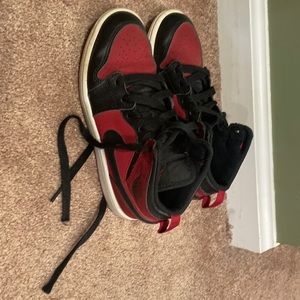 Red and black Nike Jordan’s boys